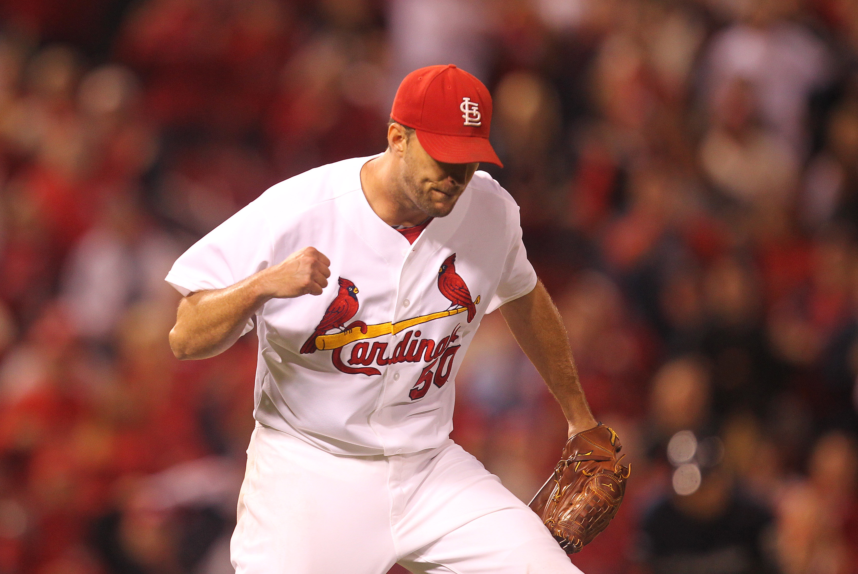 Adam Wainwright of the St. Louis Cardinals wipes his face as he sits  News Photo - Getty Images