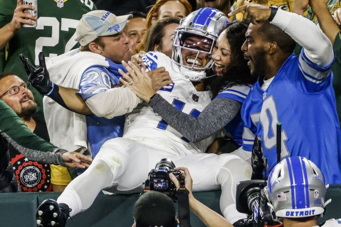 Lions' Amon-Ra St Brown met with beer shower upon Lambeau Leap